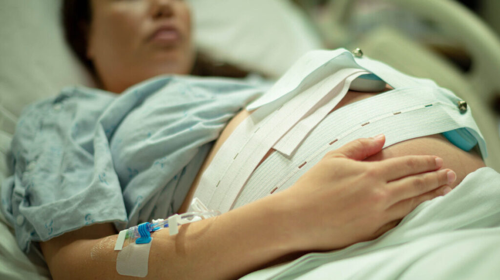 A mother in the delivery room waiting for her baby to be born.