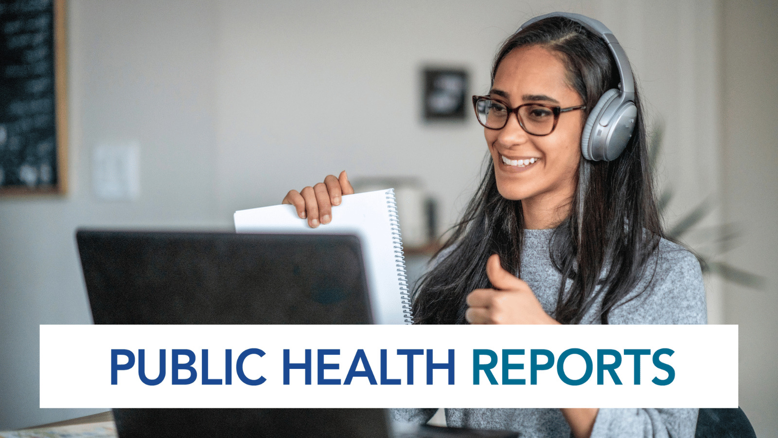 Woman with headphones on participating in virtual meeting