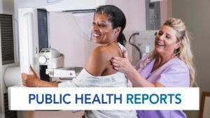 A woman receiving a mammogram check from a female health professional