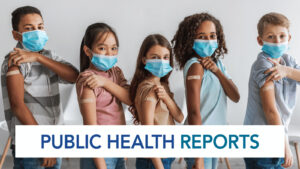 Group of five diverse kids standing in a row wearing blue surgical masks and showing their upper arms with bandages after vaccination. The text PUBLIC HEALTH REPORTS is displayed across bottom.