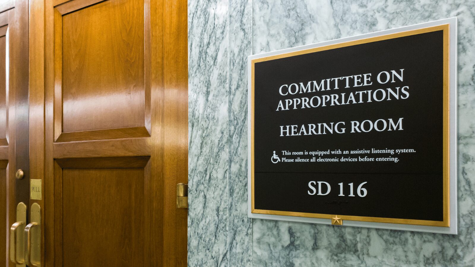 Picture of sign and door of the Committee on Appropriations Hearing Room