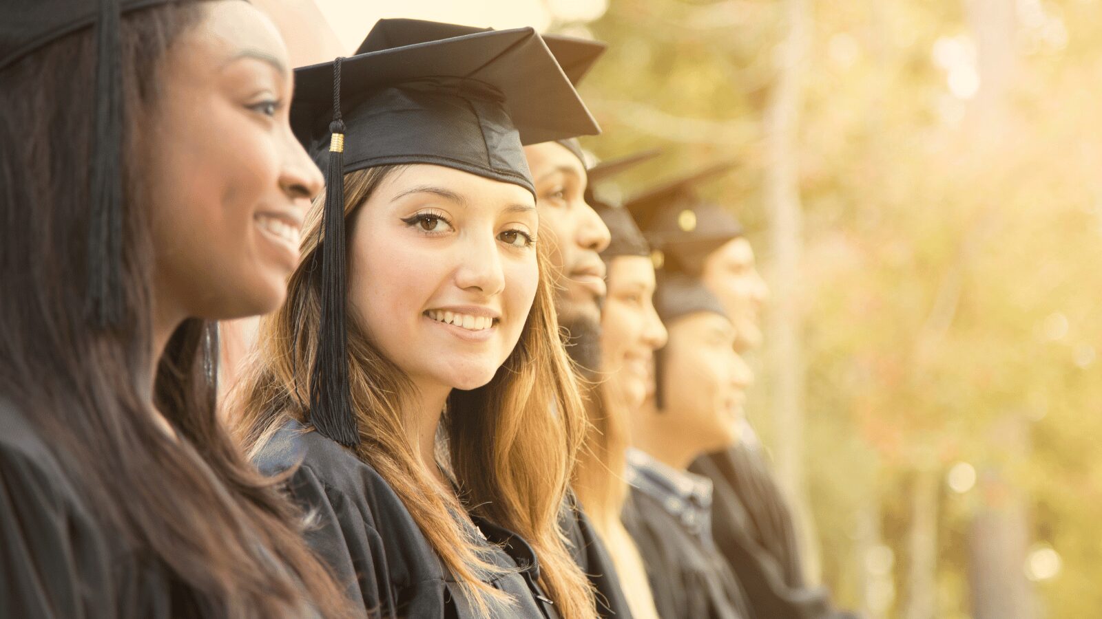 diverse graduates looking happy