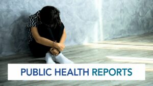 Sad child sitting on the floor hugging knees, with public health reports text overlay