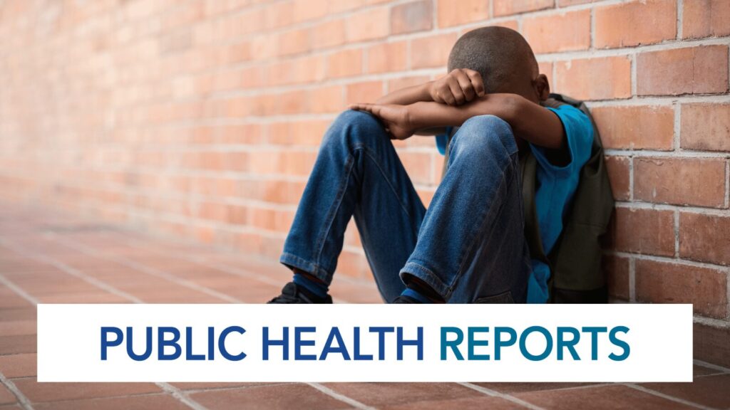 A sad child sitting on the ground with his head in his hands and Public Health Reports text overlay