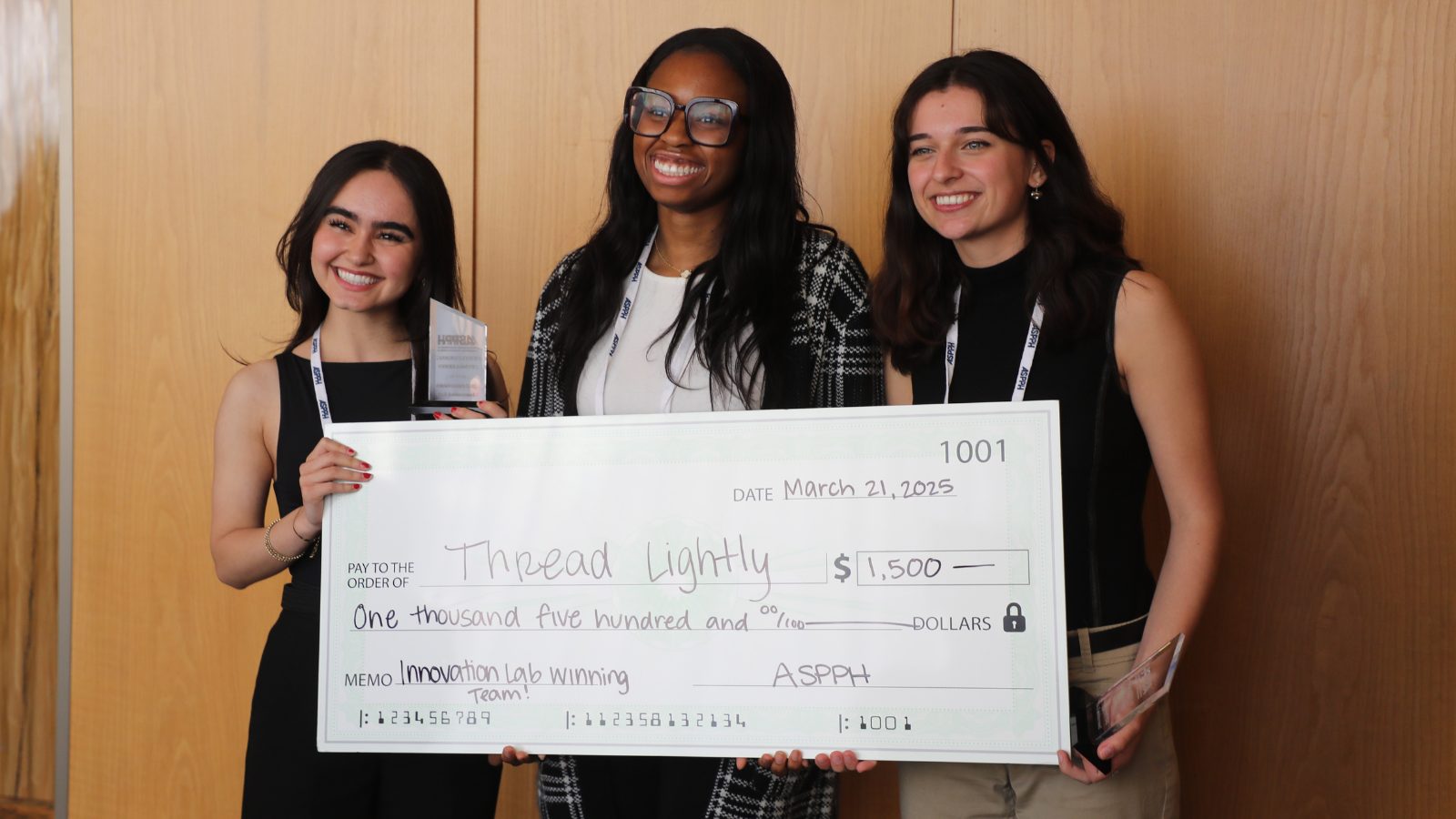 ASPPH Innovation Lab Winners smiling and posing with a large check