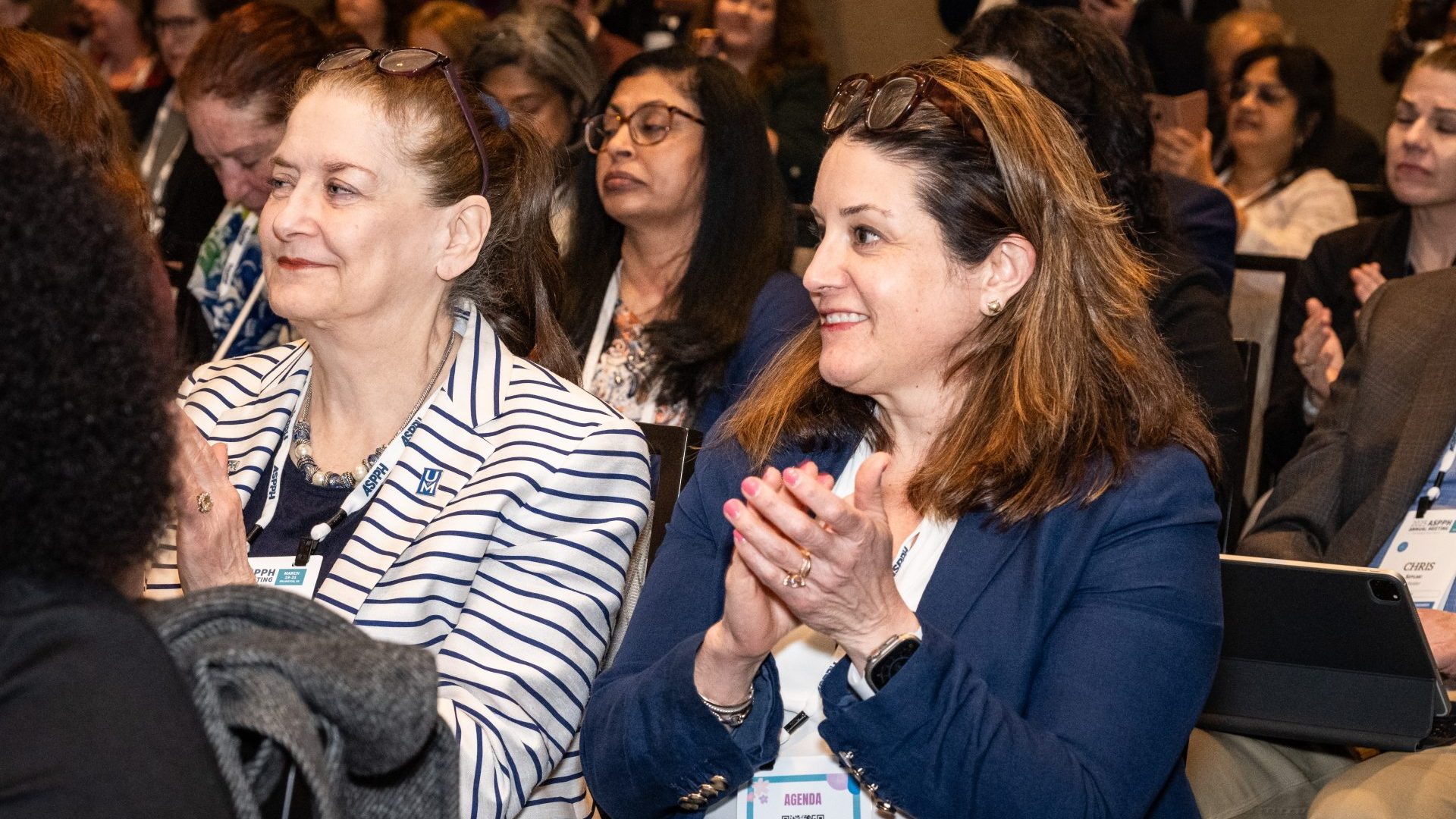 Public health professionals clapping