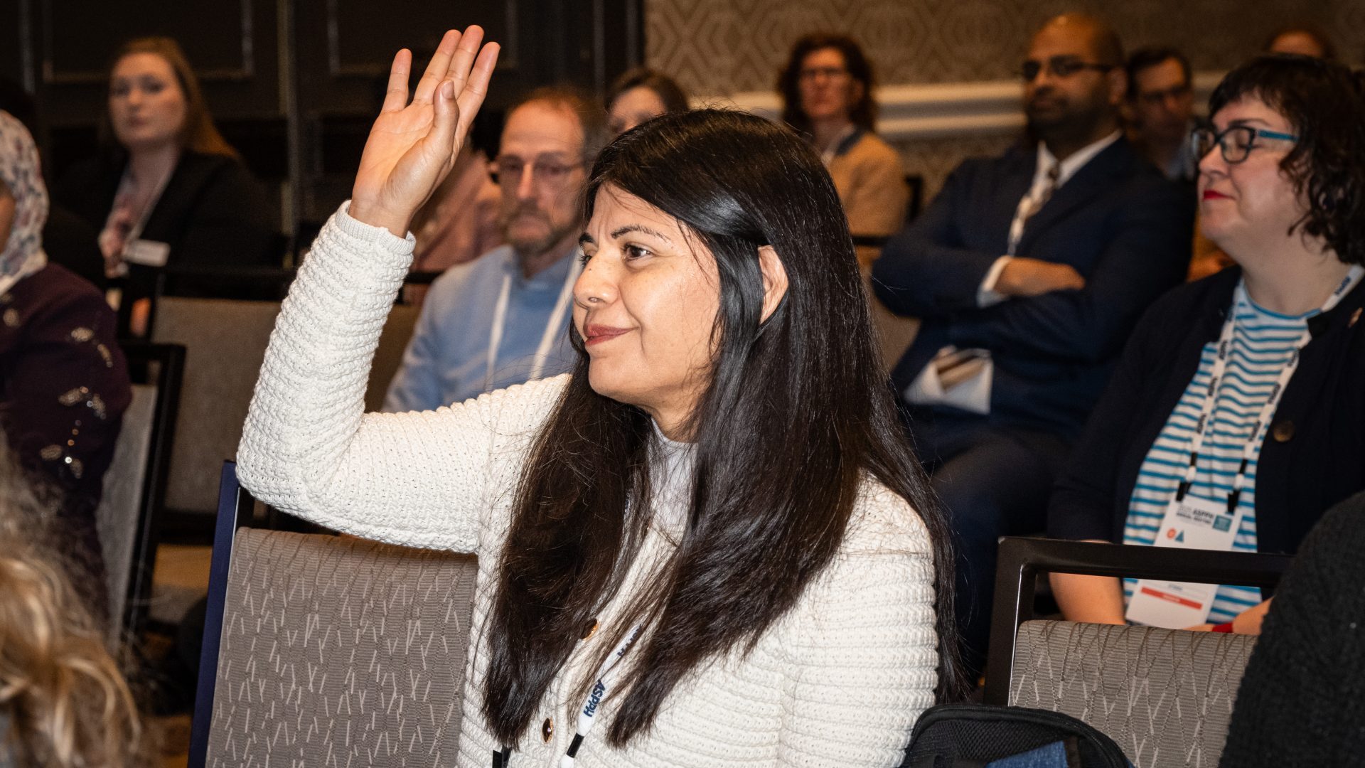A woman raising her hand