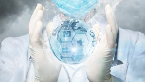 hands in medical gloves holding a globe of Earth