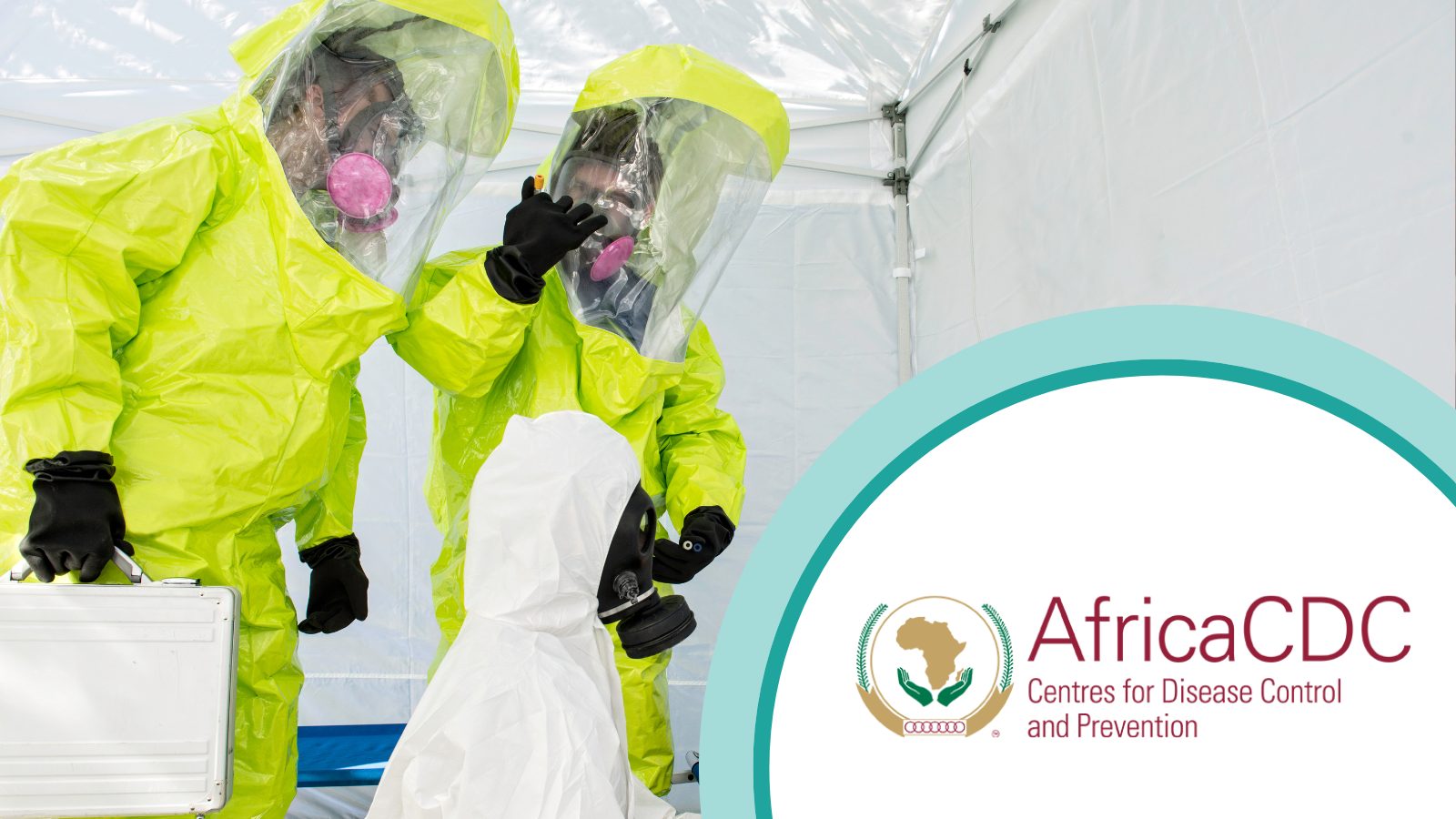 three people in hazmat suits with Africa CDC logo