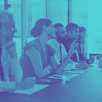 A group of stakeholders sitting at a table.