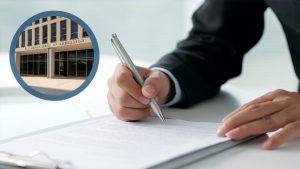 Zoomed in image of someone signing a letter and Dept of Education image