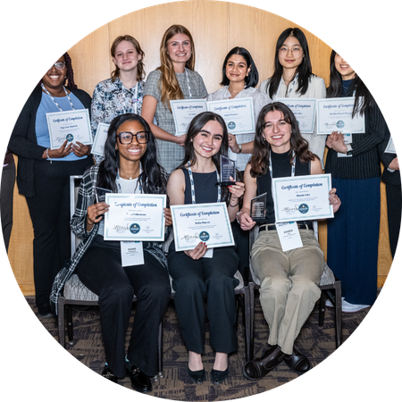 Public health students stand with their awards and certificates.