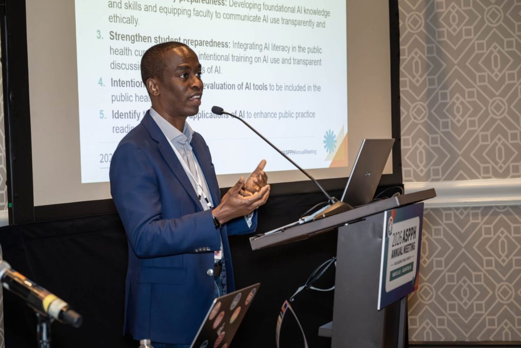 Man speaks at a podium