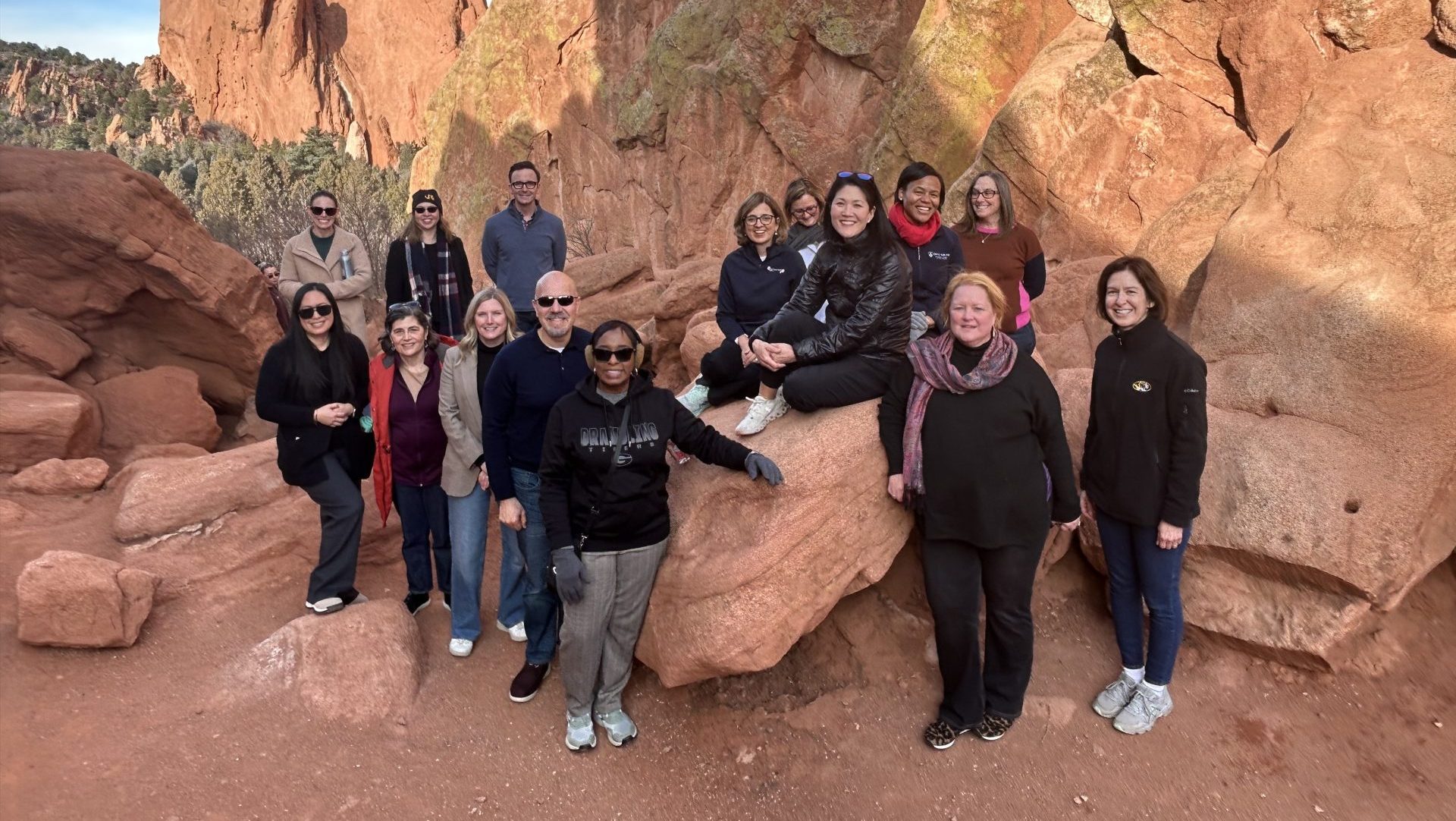 People standing on rocks in a canyon