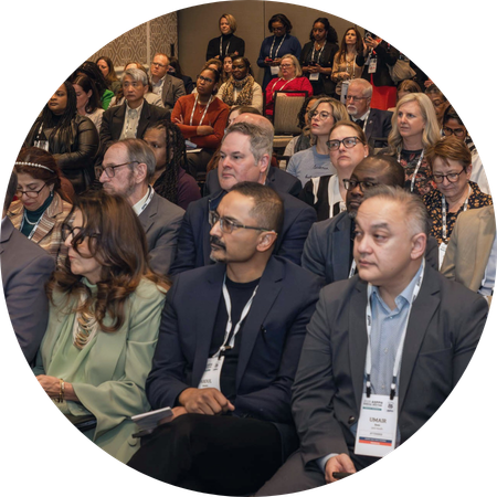 An audience watches a presentation