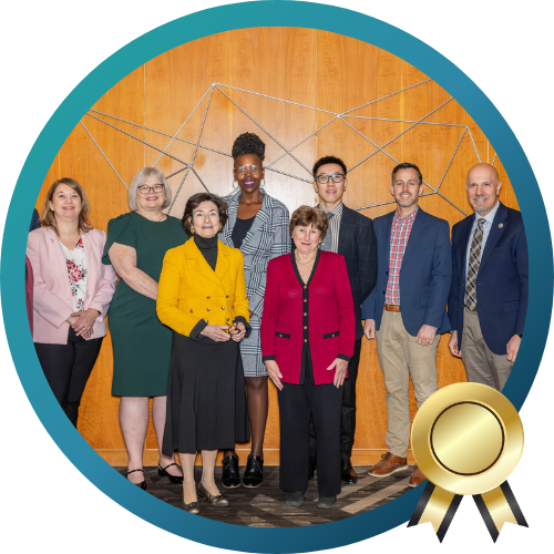 A photo of a group of people with an award banner icon 